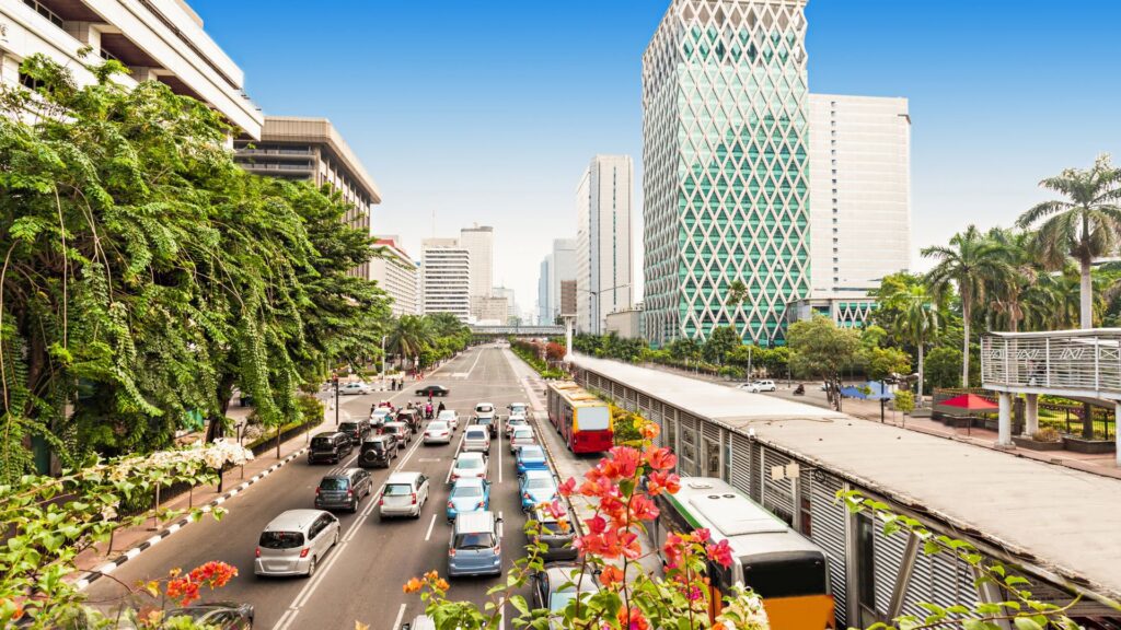 Busy street traffic and skyscrapers in Jakarta, Indonesia