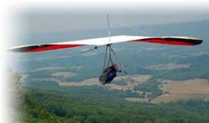 Hang Glider Soaring over mountainside