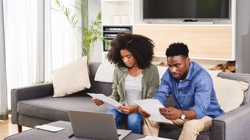 Couple reviewing their expat health insurance paperwork together at home