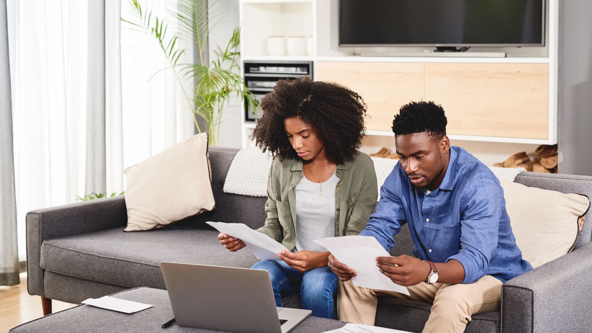 Couple reviewing their expat health insurance paperwork together at home