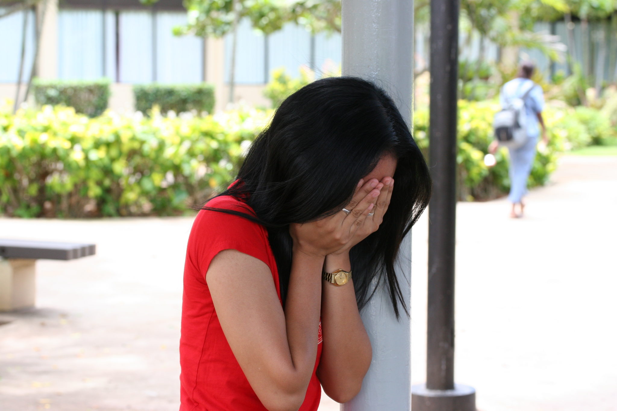 woman crying due to theft overseas
