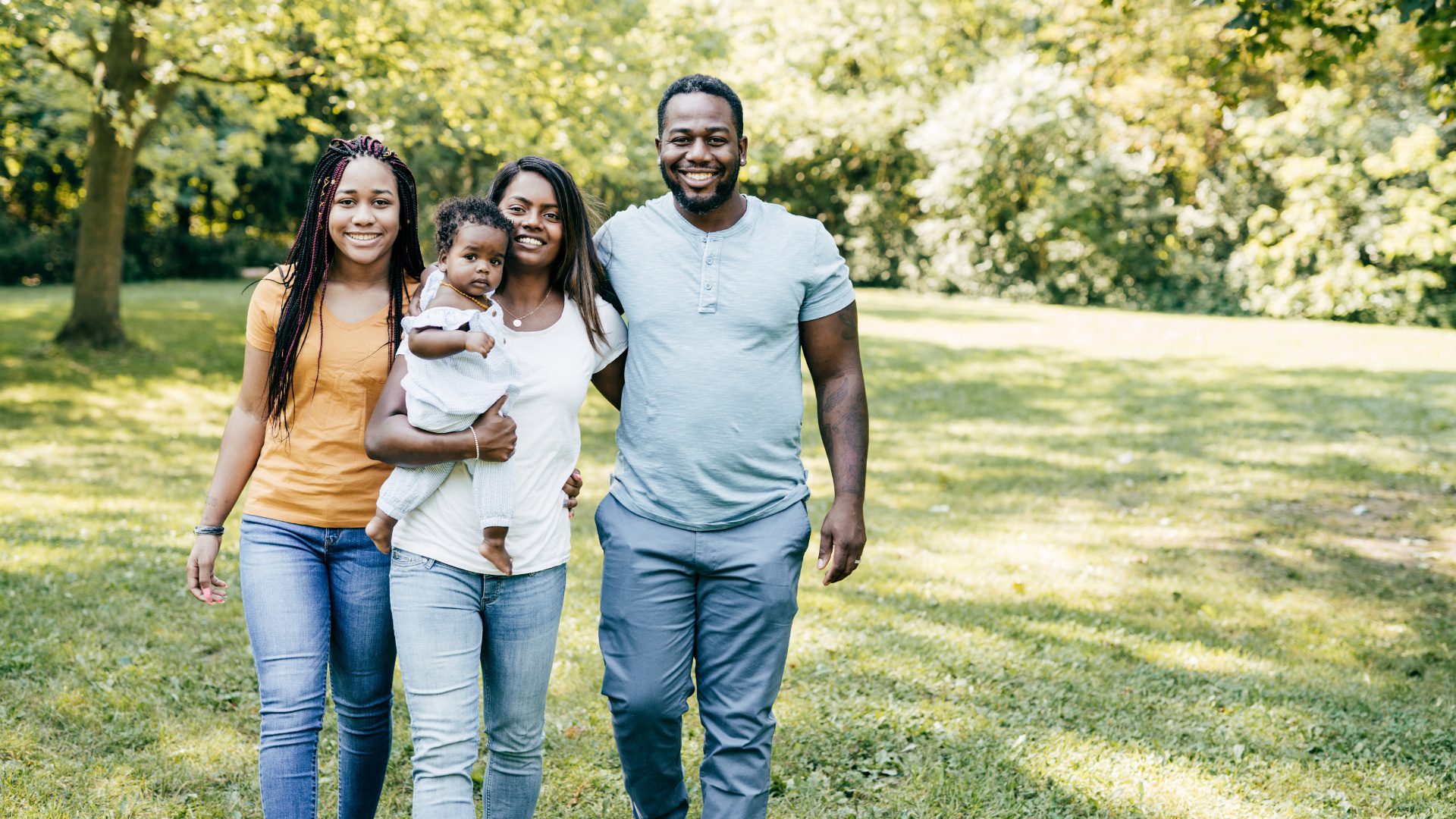 Expat family with a baby spending time together outdoors