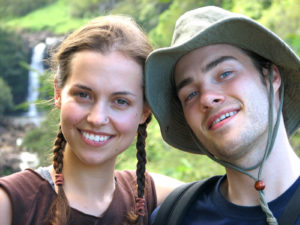 couple hiking and smiling