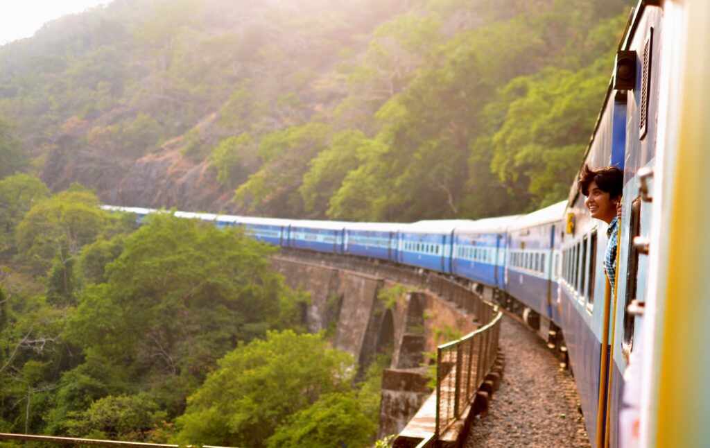 Woman riding train in India after buying an international AD&D policy